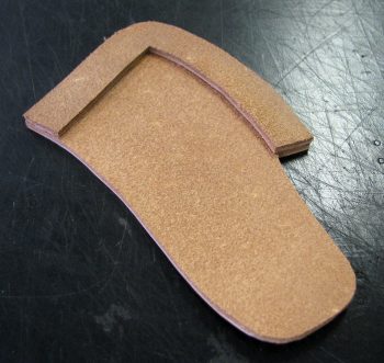 Inside welt glued to two sides of leather hatchet cover