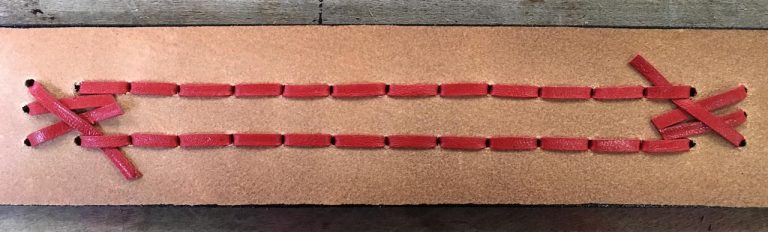 Reverse side of a finished leather braid Reverse side of a finished leather braid