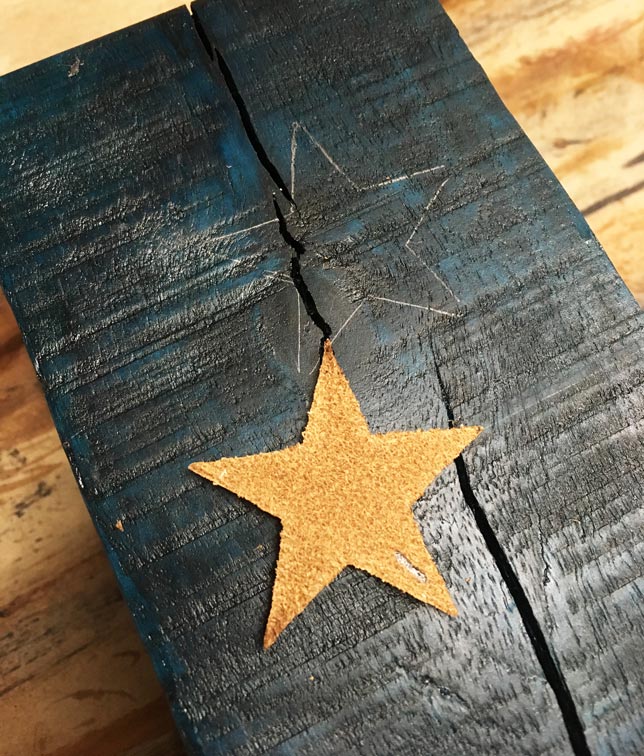 Trace the decorative leather stars onto your wood candle holders