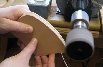 Sanding the edge of the leather axe case