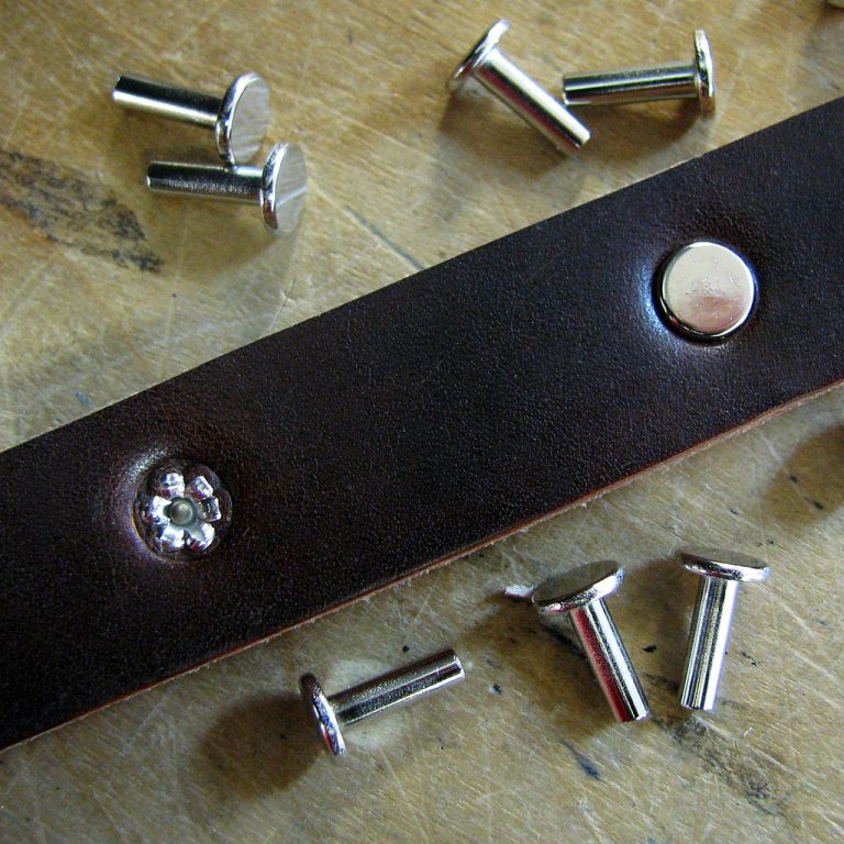 How to set tubular rivets in leather.